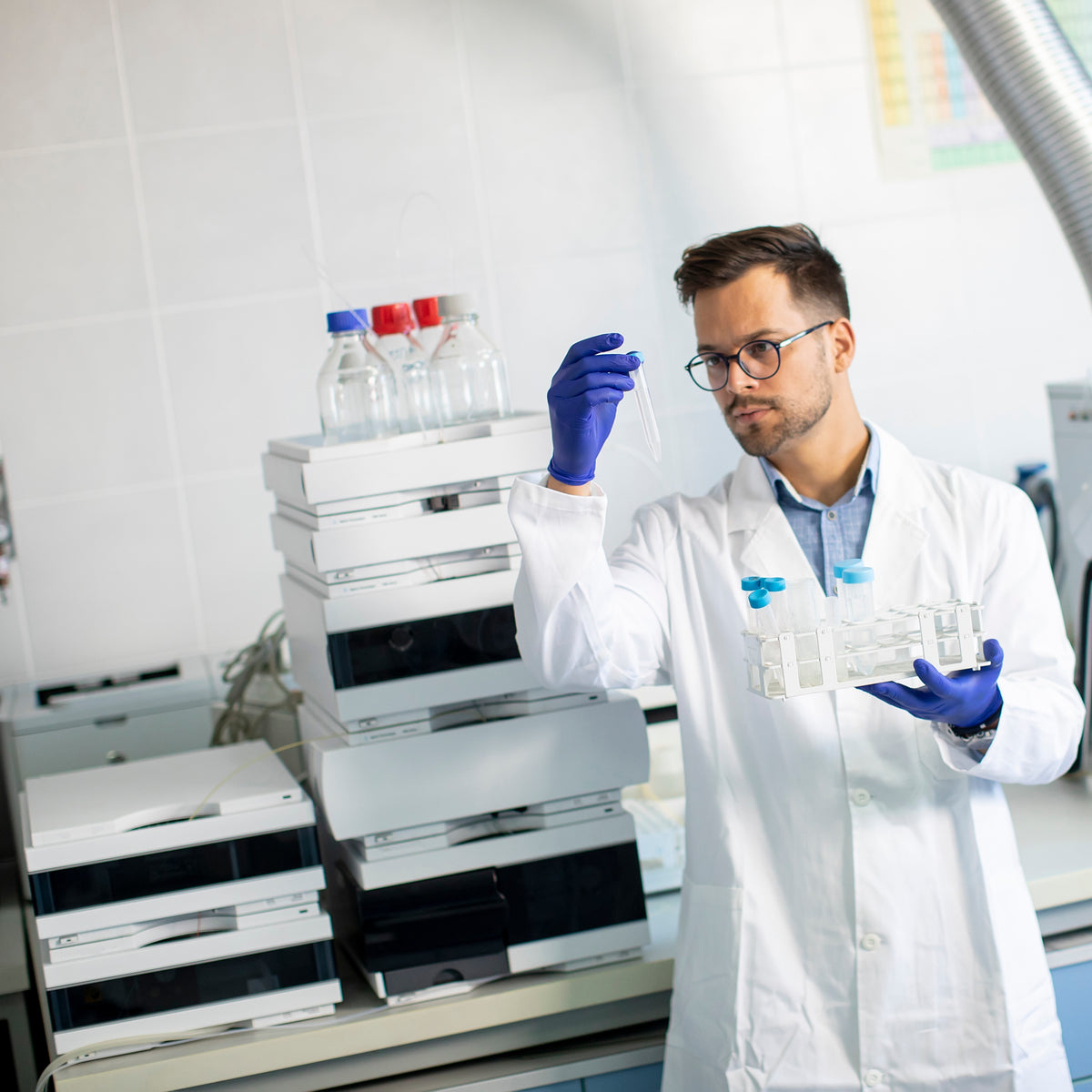Laboratory analyst performing quality control testing on samples